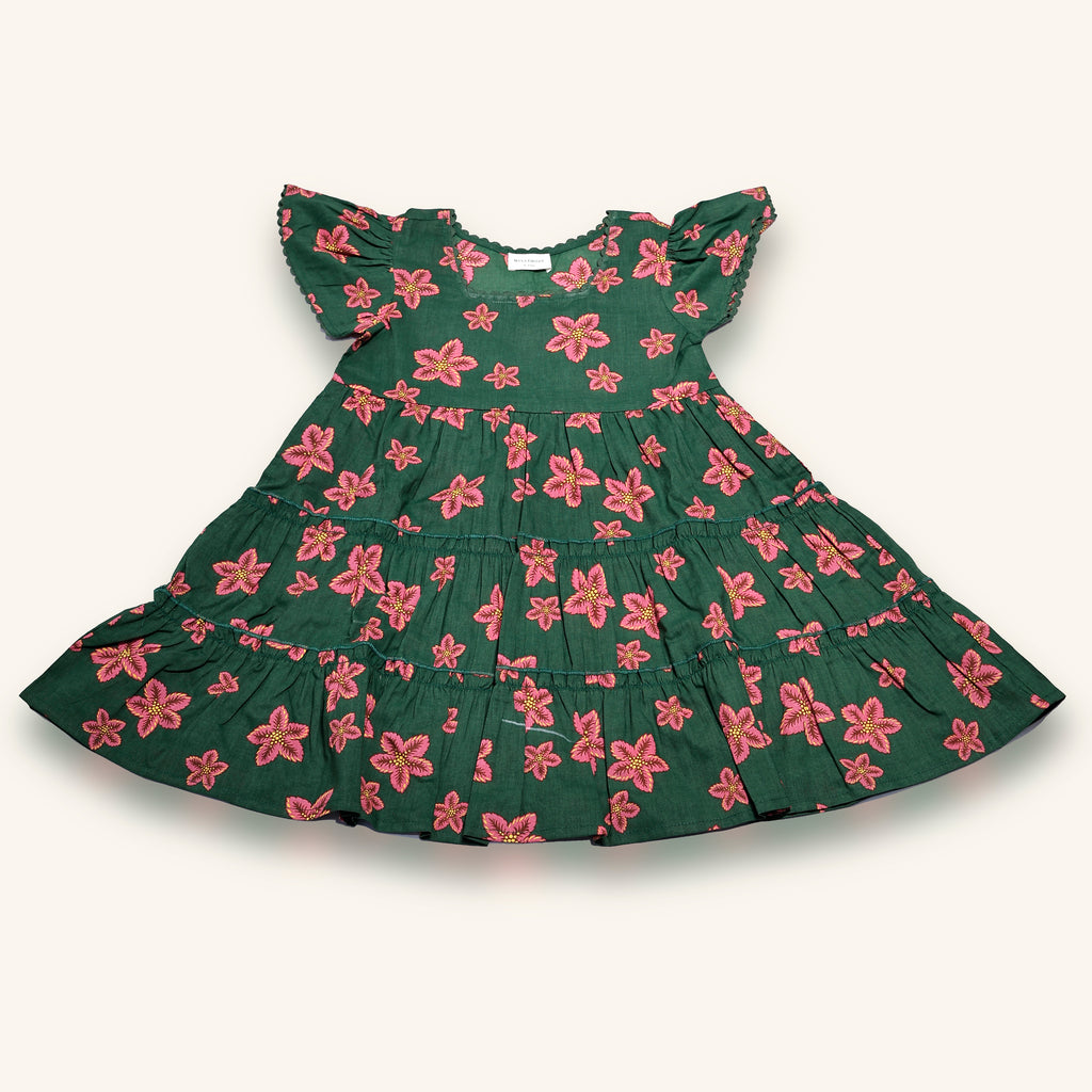 Green dress with pink floral pattern on a white background
