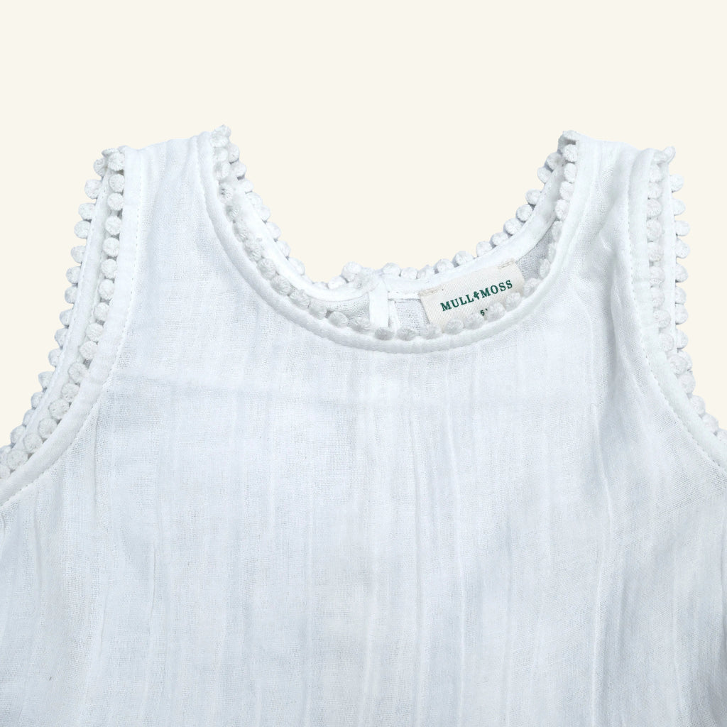 White tank top with lace trim and 'Mullaly Moss' label on a white background