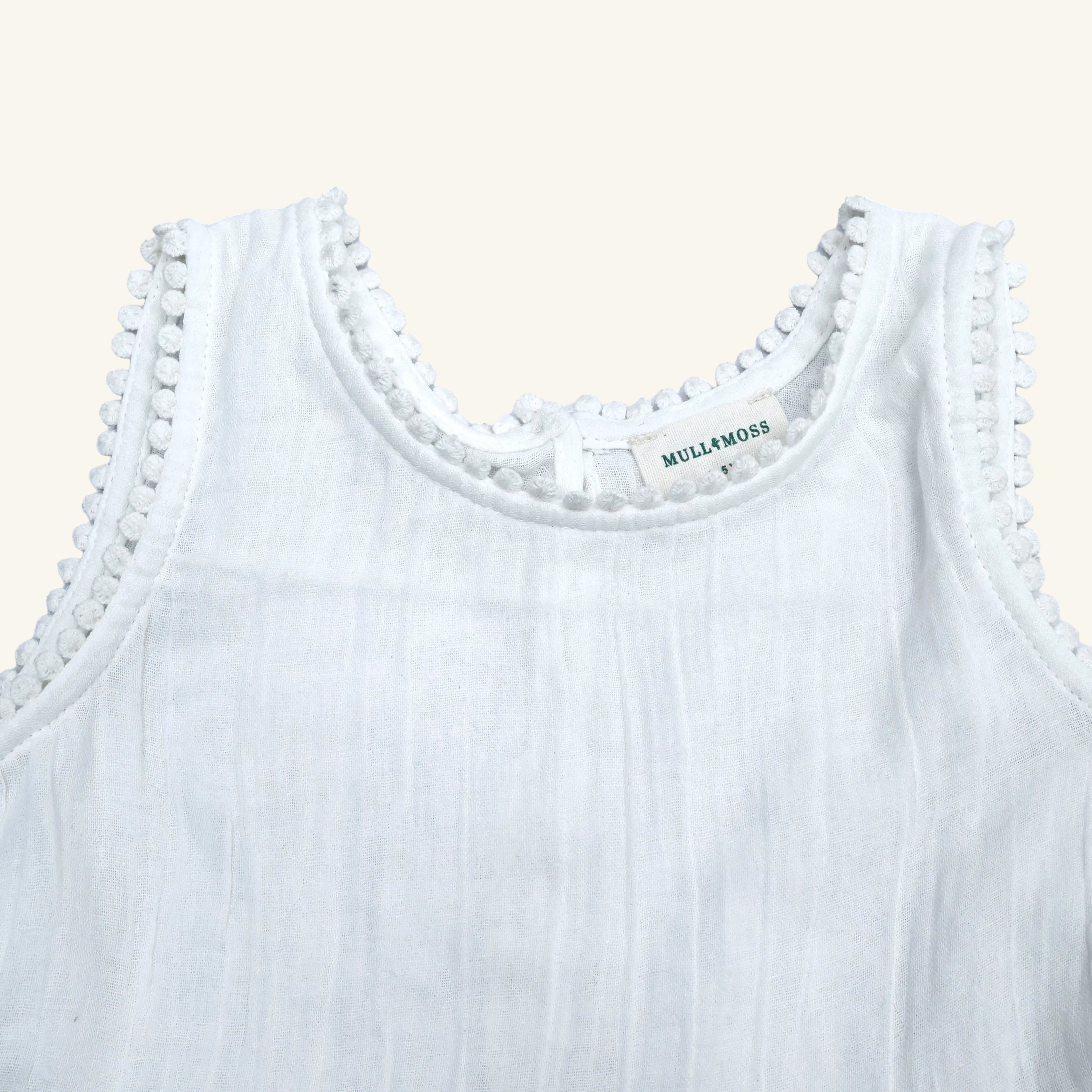 White tank top with lace trim and 'Mullaly Moss' label on a white background