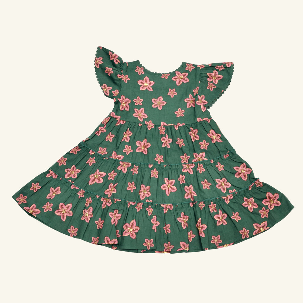 Green dress with pink floral pattern on a white background